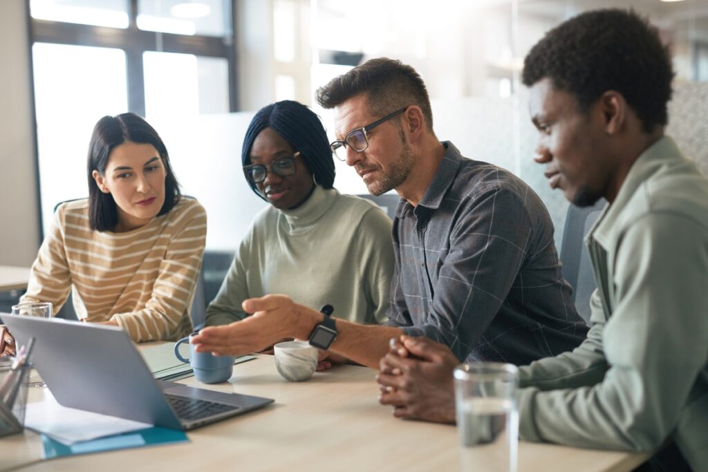 A Group of People Discussing Strata Matters